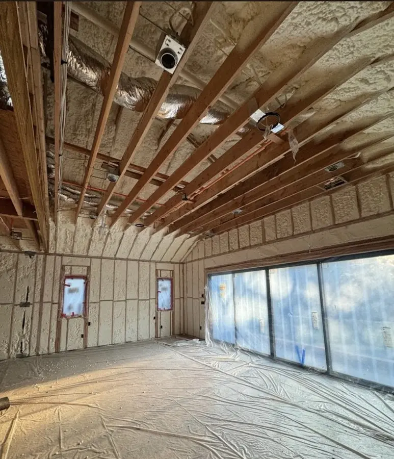 Interior walls and ceiling insulated with spray foam during new construction in Earl